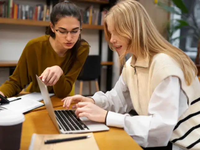 two people at laptop.png