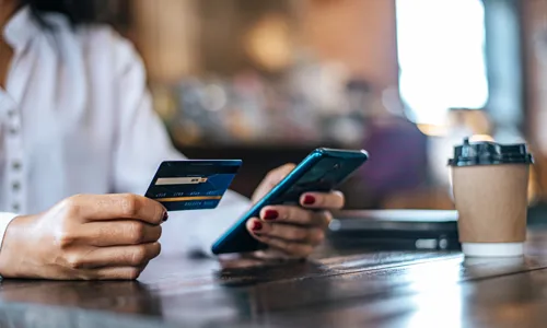 pay-goods-by-credit-card-through-smartphone-coffee-shop.jpg