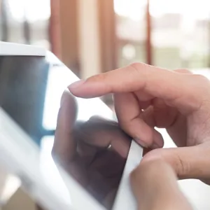 close-up-businessman-using-digital-tablet-office.jpg