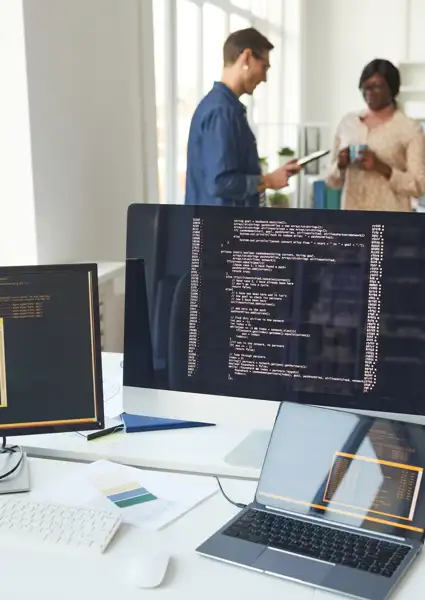 still-life-several-computer-screens-desk-it-developers-office-with-people-background-copy-space.jpg